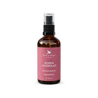 Rosenhydrolat in brauner Apothekerflasche mit Sprühaufsatz
